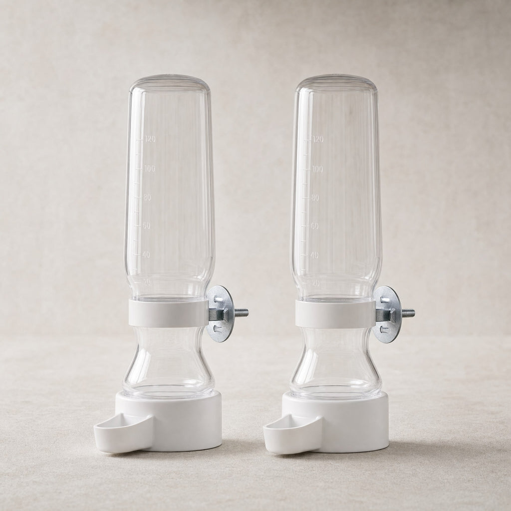 A pair of clear bird cage water feeders with white bases
